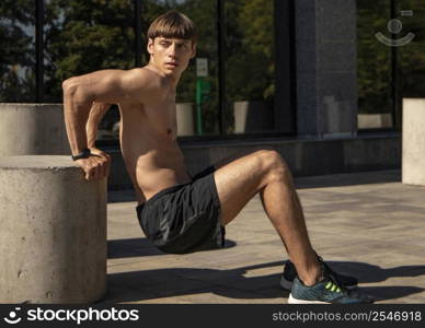 side view shirtless man training outdoors