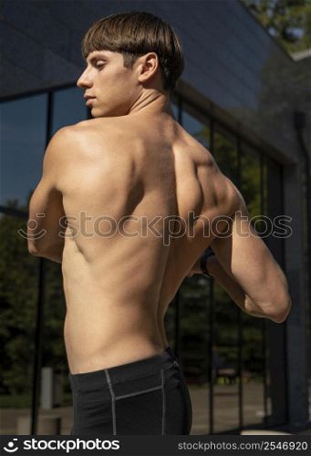 side view shirtless man working out outdoors