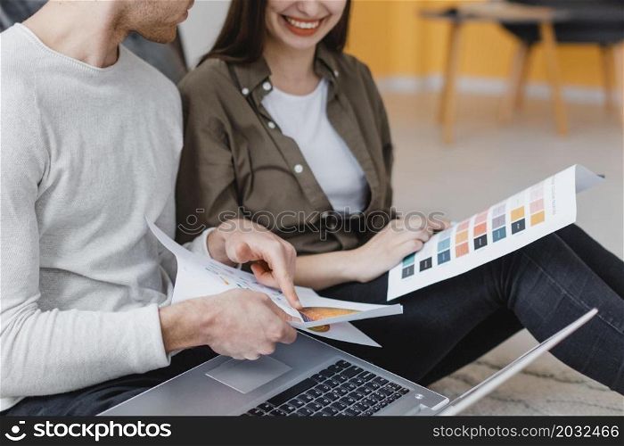 side view smiley couple planning redecorate house