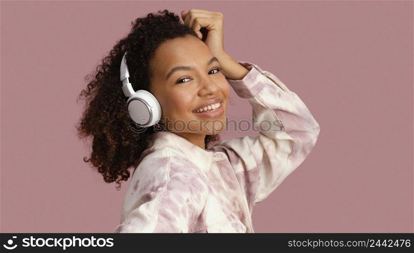 side view smiley woman with headphones