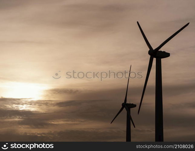 side view wind turbine silhouette generating electricity