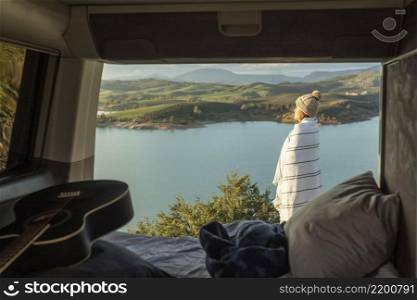 side view woman admiring nature while road trip