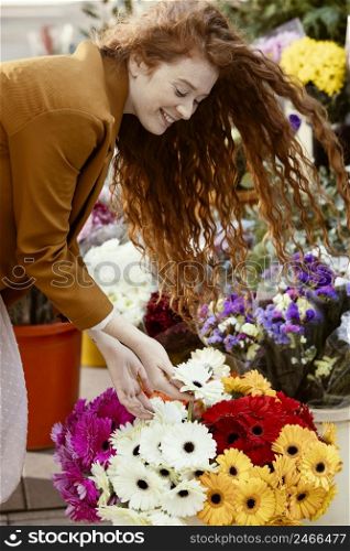 side view woman outdoors spring with bouquet flowers