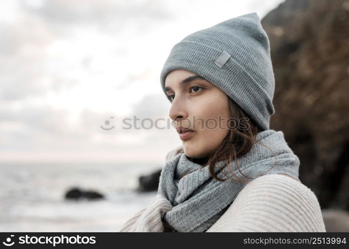 side view woman posing beach with copy space