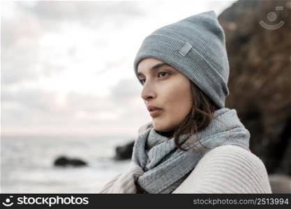 side view woman posing beach with copy space
