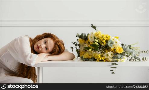 side view woman posing with bouquet spring flowers table