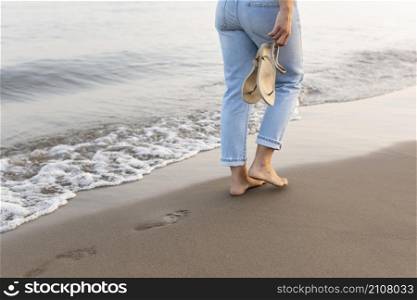 side view woman taking walk by beach