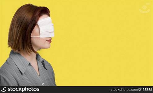 side view woman with face mask her eyes standing illuminating wall