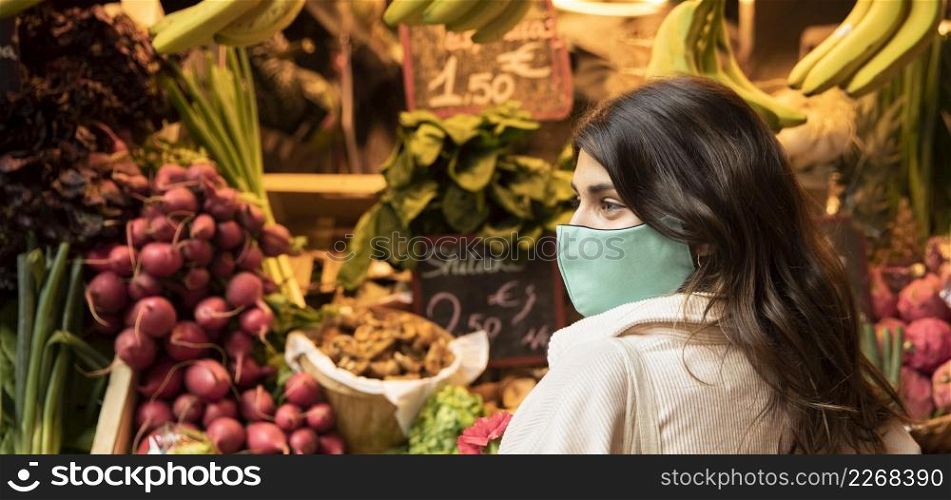 side view woman with face mask market