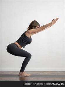 side view woman with medical mask doing yoga