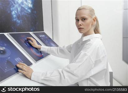 side view woman working digital monitors