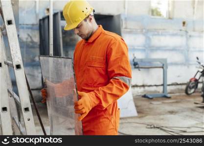 side view worker uniform with hard hat protective gloves