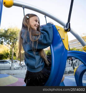 side view young girl having fun playground