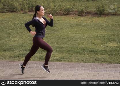 side view young woman running outdoors