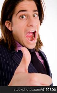 sidepose of shouting male with thumbsup on an isolated background