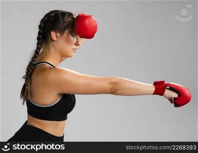 sideways girl punching with box gloves