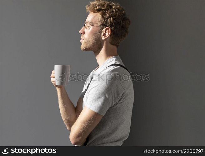 sideways man drinking his coffee