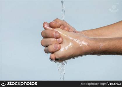 sideways person washing hands isolated blue