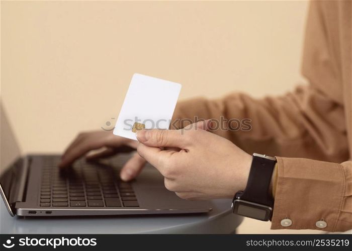 sideways woman using laptop shopping card