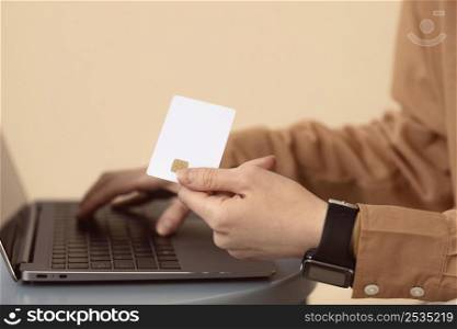 sideways woman using laptop shopping card