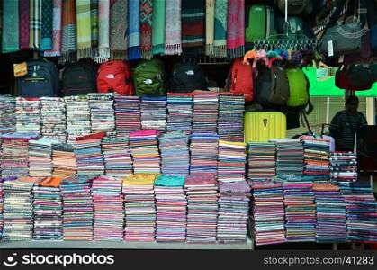SIEM REAP, CAMBODIA - OCT 22, 2016: Kroma or krama (scarf) cotton khmer cloths for sale at a market in siem reap,angkor in Cambodia. Cambodian textiles are very popular souvenirs for travellers.