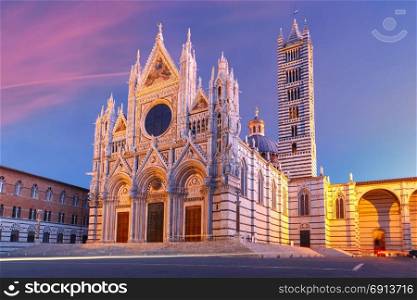 Siena Cathedral at sunrise, Tuscany, Italy. Beautiful view of facade and campanile of Siena Cathedral, Duomo di Siena at sunrise, Siena, Tuscany, Italy