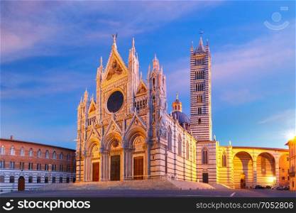 Siena Cathedral at sunrise, Tuscany, Italy. Beautiful view of facade and campanile of Siena Cathedral, Duomo di Siena at sunrise, Siena, Tuscany, Italy