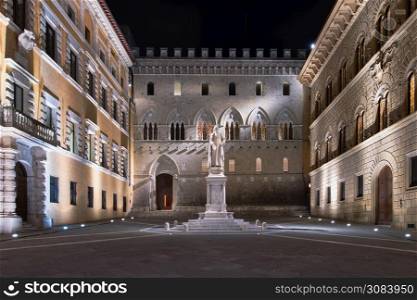 SIENA, ITALY - MARCH 4, 2019: Salimbeni square in Siena. With the monument of Sallustio Bandini