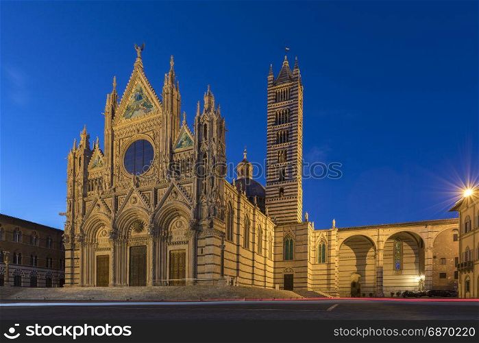 Siena - Italy. The 12th century Siena Cathedral (The Duomo) at dusk. A masterpiece of Italian Romanesque-Gothic architecture.
