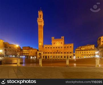 Siena. The central city square piazza del Campo.. Facades of medieval buildings on Piazza del Campo at night. Siena. Tuscany. Italy.