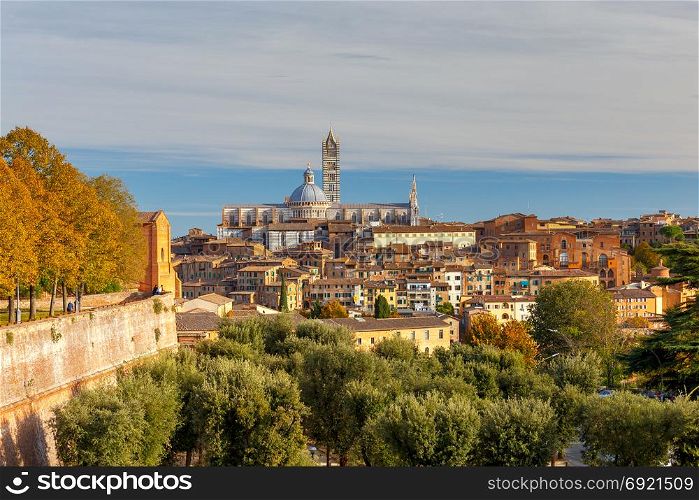 Siena. View of the old city district.. Old medieval district and cathedral in the city Siena. Tuscany. Italy.