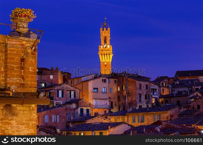 Siena. View of the old town on the sunset.. View of the old medieval quarters on the sunset. Siena. Italy.