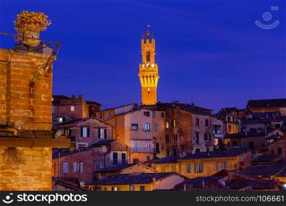 Siena. View of the old town on the sunset.. View of the old medieval quarters on the sunset. Siena. Italy.
