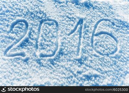 Sign 2016 on the snow. New year background
