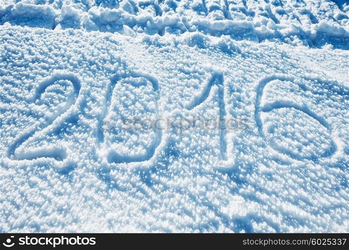 Sign 2016 on the snow. New year background
