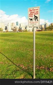 Sign clean up after your dog. Green park. Vancouver, Canada