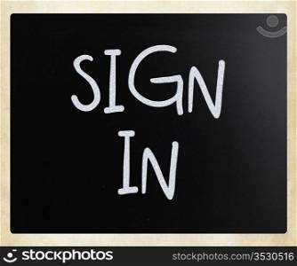 ""sign in" handwritten with white chalk on a blackboard."