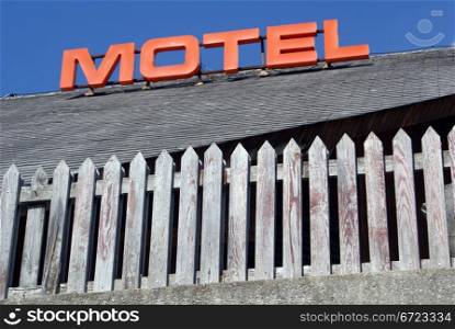Sign of motel on the wooden house