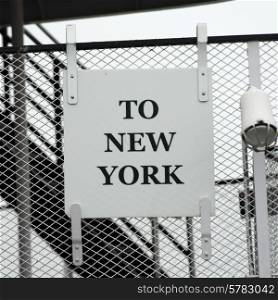 Sign on chainlink fence, Liberty Island, Manhattan, New York City, New York State, USA
