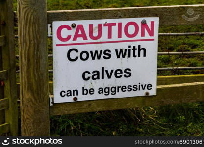 Sign on country gate Caution cows with calves can be aggressive.