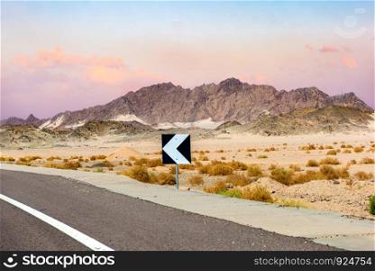 Sign on road in the desert of Egypt at sunset. Sign on road in Egypt