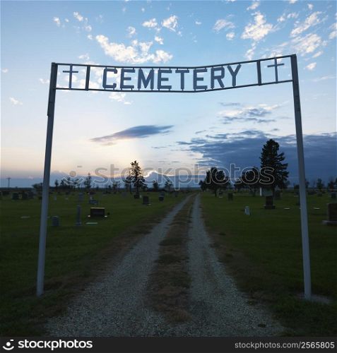 Sign over entrance to cemetary at dusk in rural South Dakota.