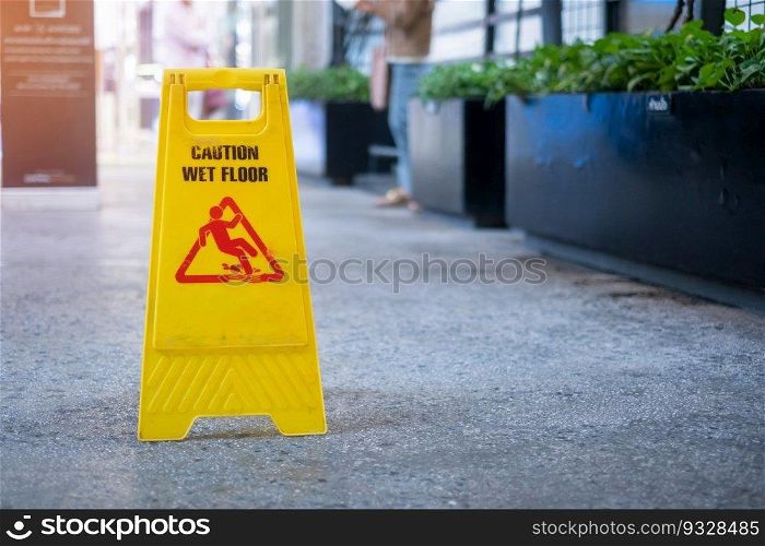 Sign showing warning of caution wet floor in office building