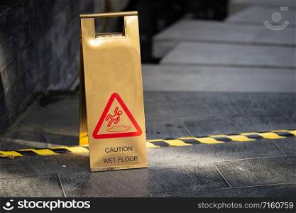 Sign showing warning of caution wet floor near wet area