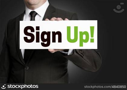 sign up plate held by businessman concept. sign up plate held by businessman concept.