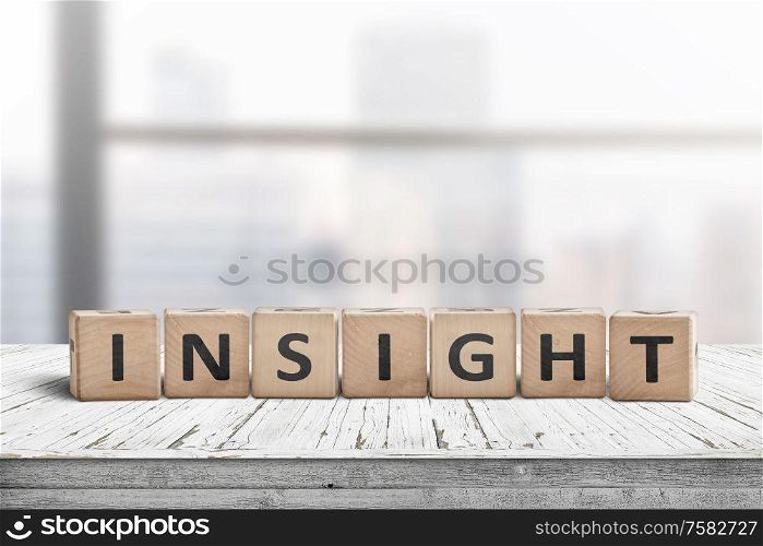 Sign with the word insight in a bright office environment on a white table