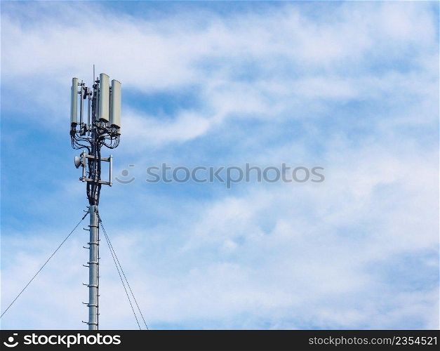 Signal or mobile phone tower against blue sky. Radio antenna. Modern telecommunication by using 5g or 4g internet.. Cellular network antenna against blue sky.