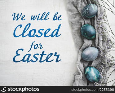 Signboard with the inscription We will be closed for Easter. Easter eggs painted with colorful paints. Closeup, indoors, no people. Congratulations for loved ones, relatives, friends, colleagues. Signboard with the inscription We will be closed for Easter
