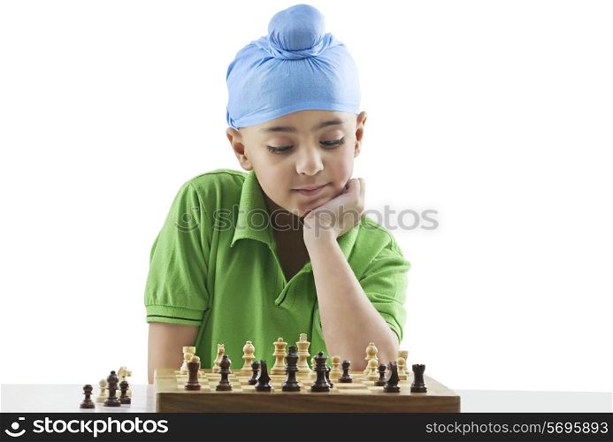 Sikh boy playing chess