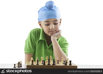 Sikh boy playing chess